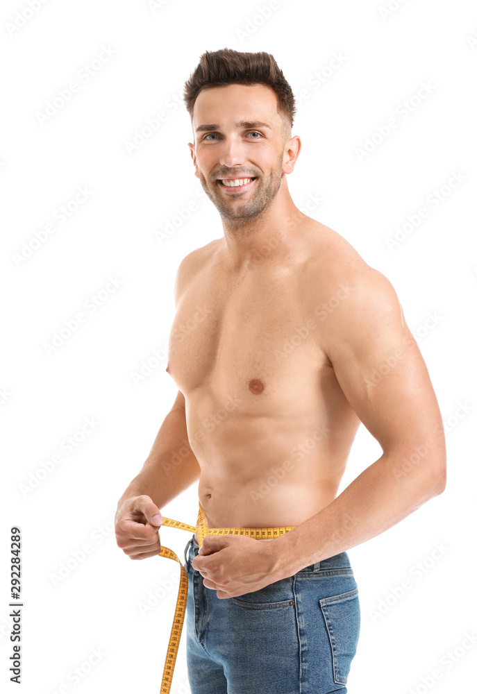 Handsome muscular man with measuring tape on white background. Weight loss concept Handsome muscular man with measuring tape on white background. Weight loss concept