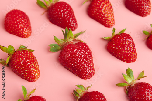 Strawberries on pink background. Fresh organic food concept