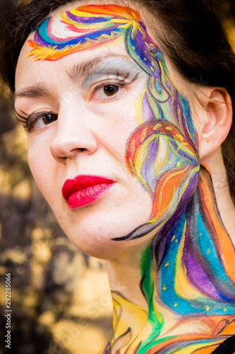 Beautiful girl, woman, body art, drawn drawing on the face close-up