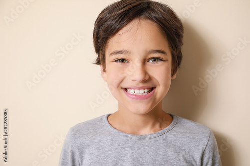 Cute little boy on light ba...