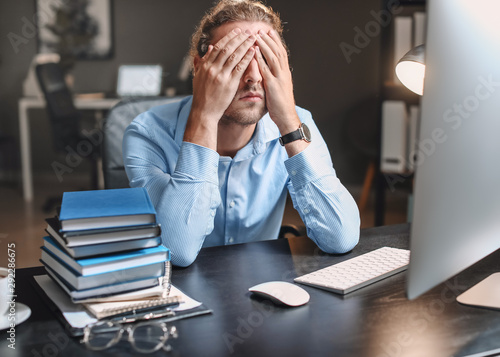 Tired man trying to meet de...