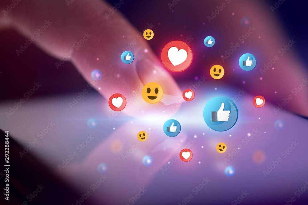 Finger touching phone with social media concept and dark background