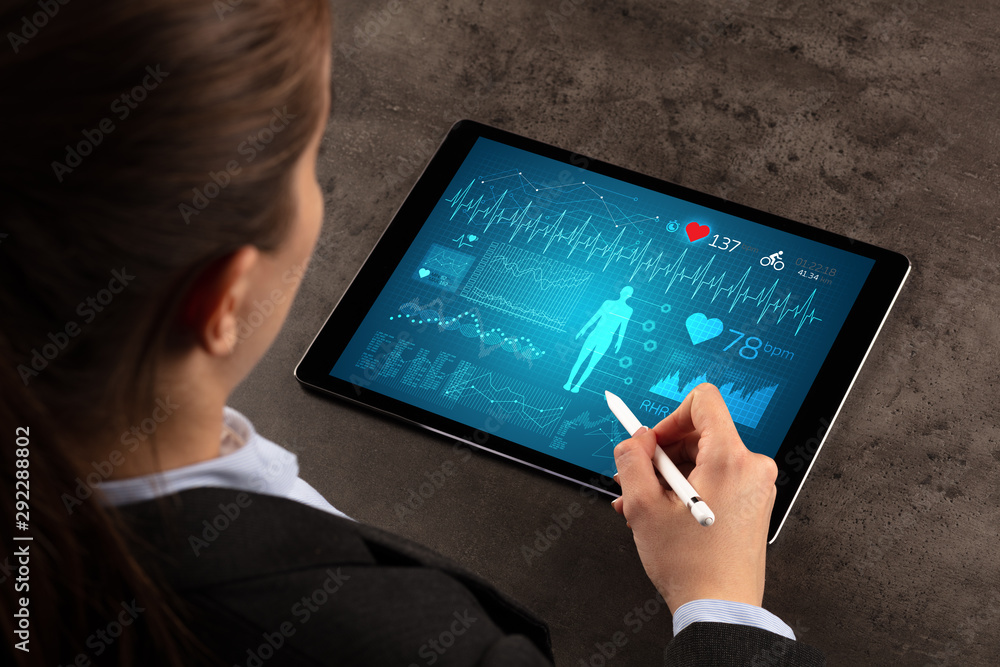 Business woman making healthy analysis on tablet Business woman making healthy analysis on tablet