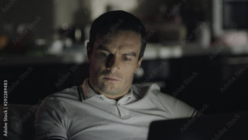Serious business man working night at remote workplace. Serious business man working night at remote workplace.