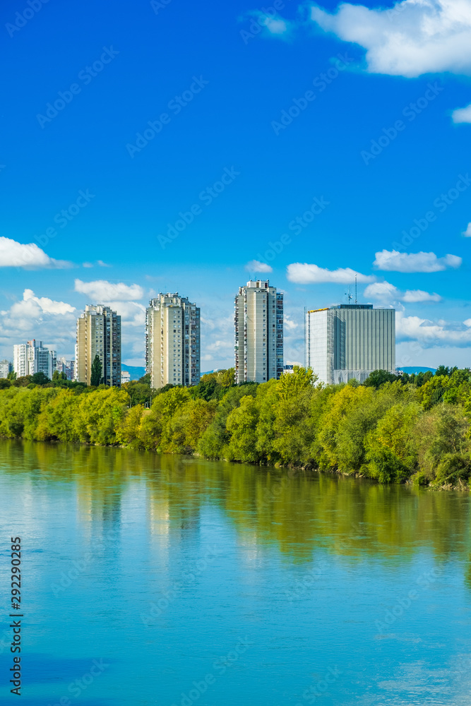 Croatia, city of Zagreb, surface of the Sava river and modern towers skyline in autumn day