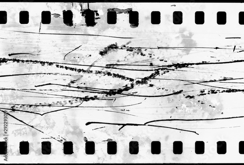 Blank grained and scratched film strip texture background.  old film effect