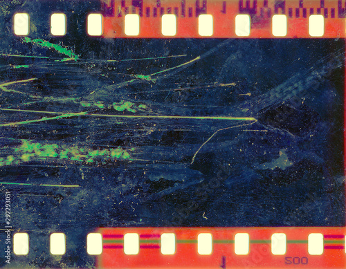 Blank grained and scratched film strip texture background.  old film effect