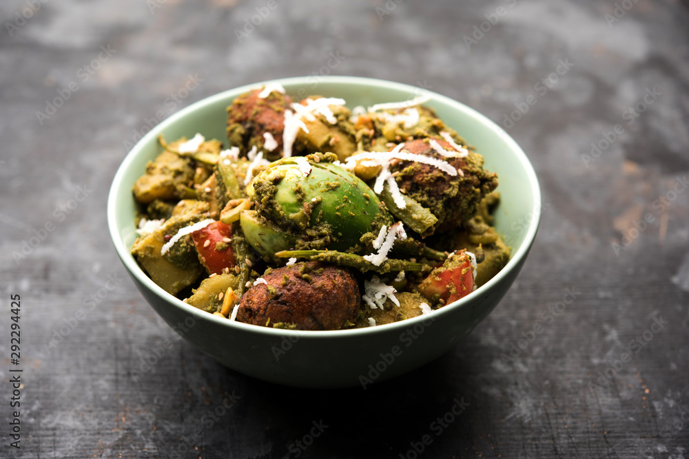 Undhiyu is a Gujarati mixed vegetable dish, specialty of Surat, India. Served in a bowl with or without poori Undhiyu is a Gujarati mixed vegetable dish, specialty of Surat, India. Served in a bowl with or without poori