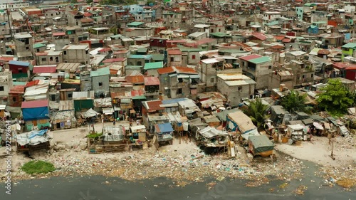 Slums in Manila, a top view. Sea pollution by household waste. Plastic trash on the beach.