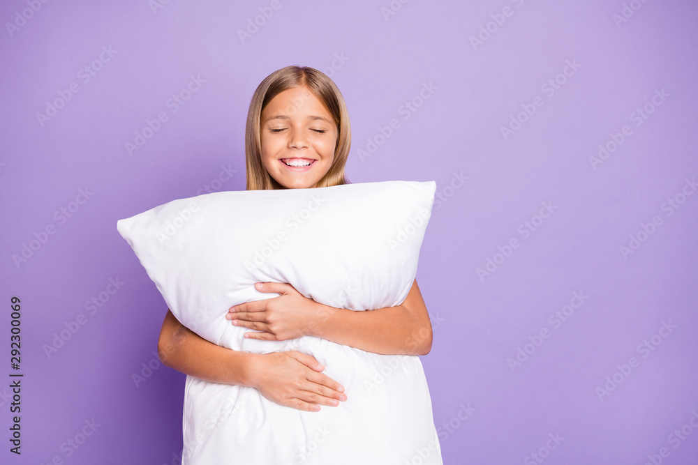 Portrait of positive cheerful kid enjoy bed time hug embrace her pillow have weekends nap feel sleepy daydreaming isolated over violet purple color background - obrazy, fototapety, plakaty 