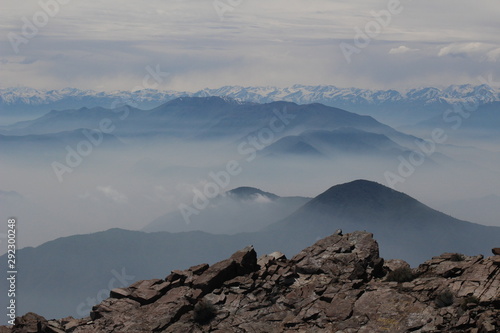 mountains view with clouds and mist from a peak