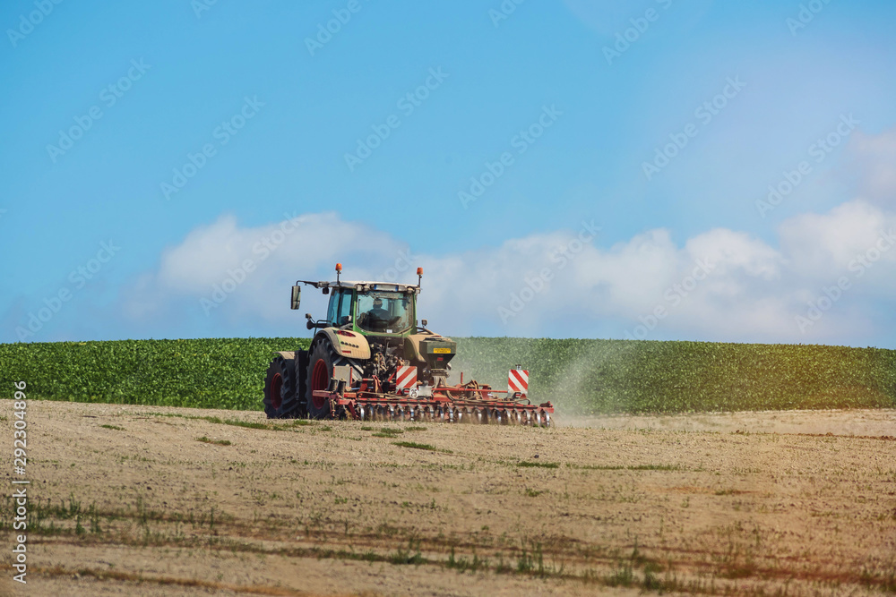 Obraz premium nice view of a farmer plowing his fields