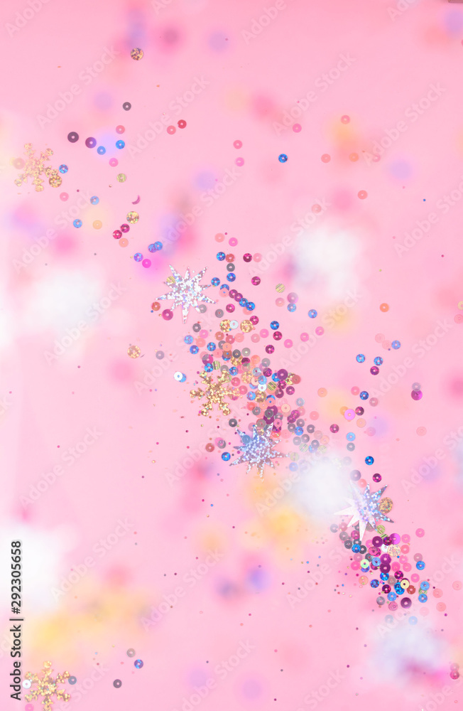 Festive and shiny background. Little stars on a light pink background. Festive and shiny background. Little stars on a light pink background.