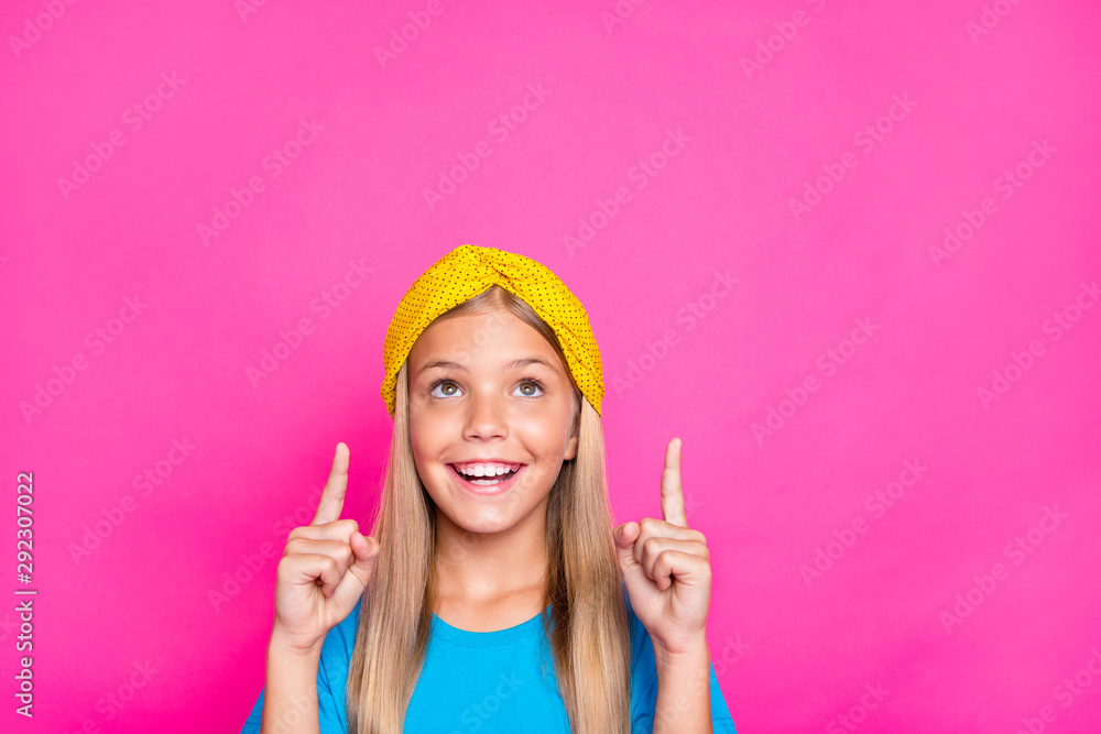Close up photo of cheerful positive funny funky child point index finger indicate ads recommend her choice decision advice wear blue clothes isolated over pink color background Close up photo of cheerful positive funny funky child point index finger indicate ads recommend her choice decision advice wear blue clothes isolated over pink color background