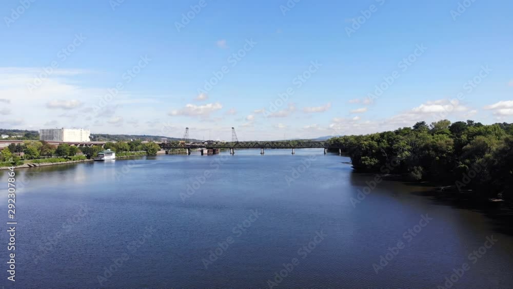 Reverse shot of hudson river and train bridge receding into distance as height increases Reverse shot of hudson river and train bridge receding into distance as height increases
