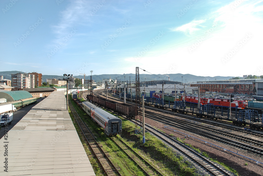 Railway station with freight and passenger trains in the city of Krasnoyarsk
