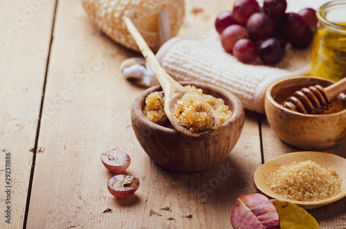 Fotografie, Obraz Ingredients for body scrub of brown sugar with grape and  oil, eco bio friendly cosmetic for skin care