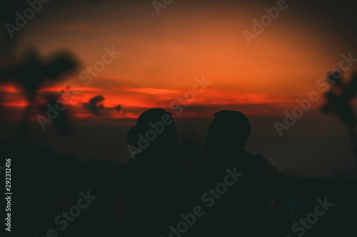 dark sunset sitting two couple 