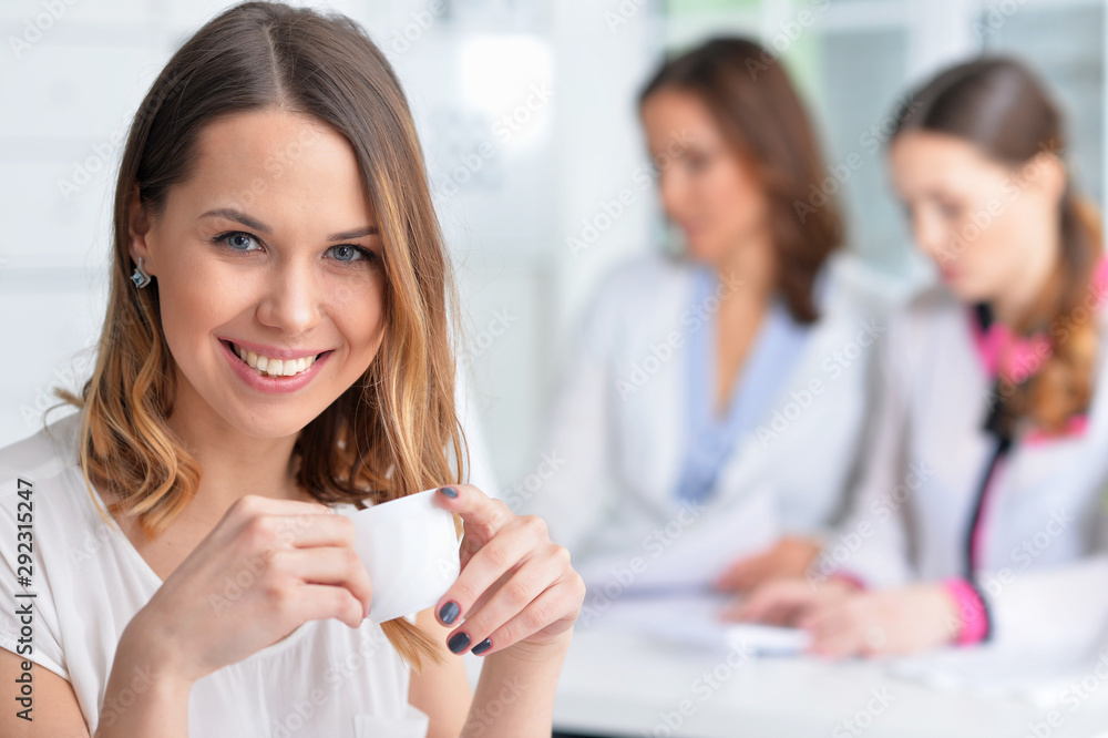 Portrait of young women working in modern office Portrait of young women working in modern office