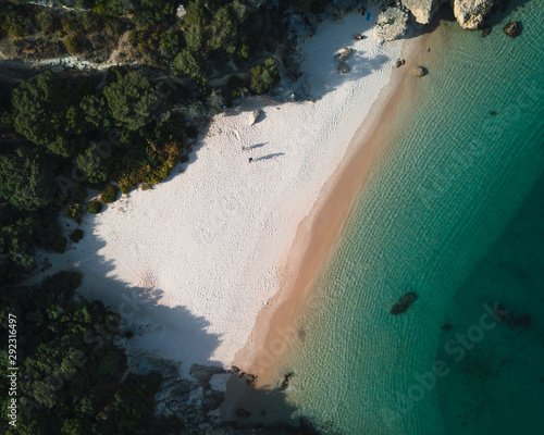 Aerial view of a tropical paradise beach with white sand and clear water in Nature Park Arrabida in Setubal, Portugal. photo