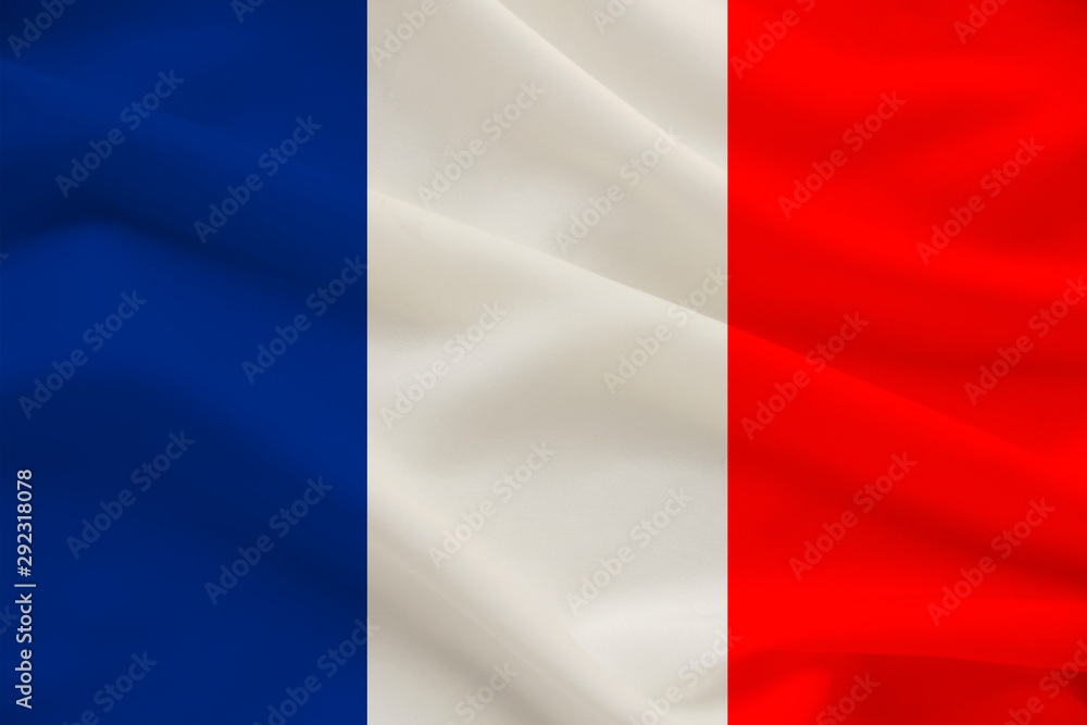 Obraz premium national flag of the country france on gentle silk with wind folds, travel concept, immigration, politics, copy space, close-up