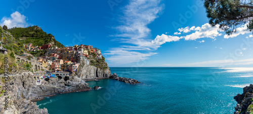Panorama of Manarola in Cinque Terre, Italy, with the Mediterranean Sea on a sunny summer day