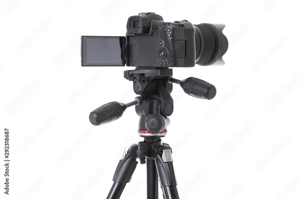 Back view of black camera standing on holder isolated