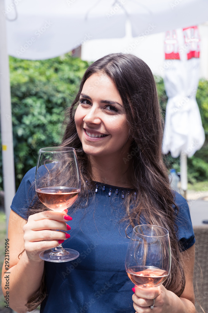 Young happy woman with glass of wine. Young happy woman with glass of wine.