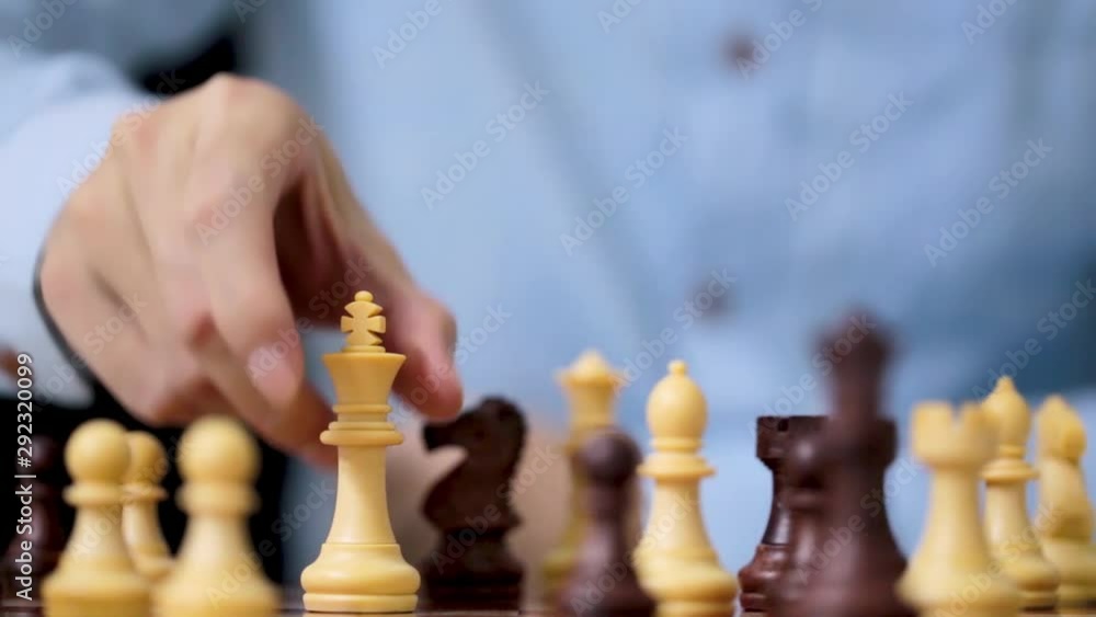 Businessman play with chess game in competition success play, concept strategy and successful management or leadership Businessman play with chess game in competition success play, concept strategy and successful management or leadership