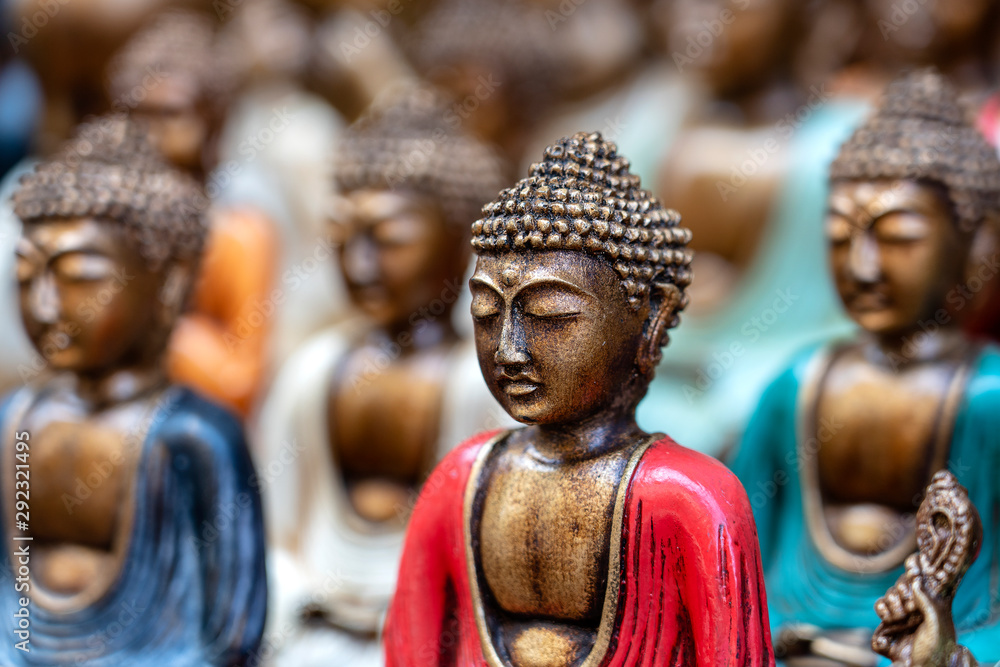 Buddha statue figures souvenir on display for sale on street market in Bali, Indonesia. Handicrafts and souvenir shop display, close up Buddha statue figures souvenir on display for sale on street market in Bali, Indonesia. Handicrafts and souvenir shop display, close up