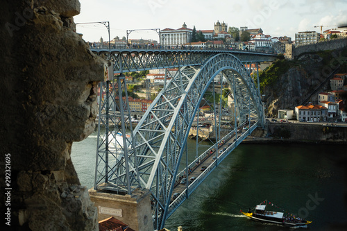 View of Dom Luis I bridge and the Douro river from abandoned building.