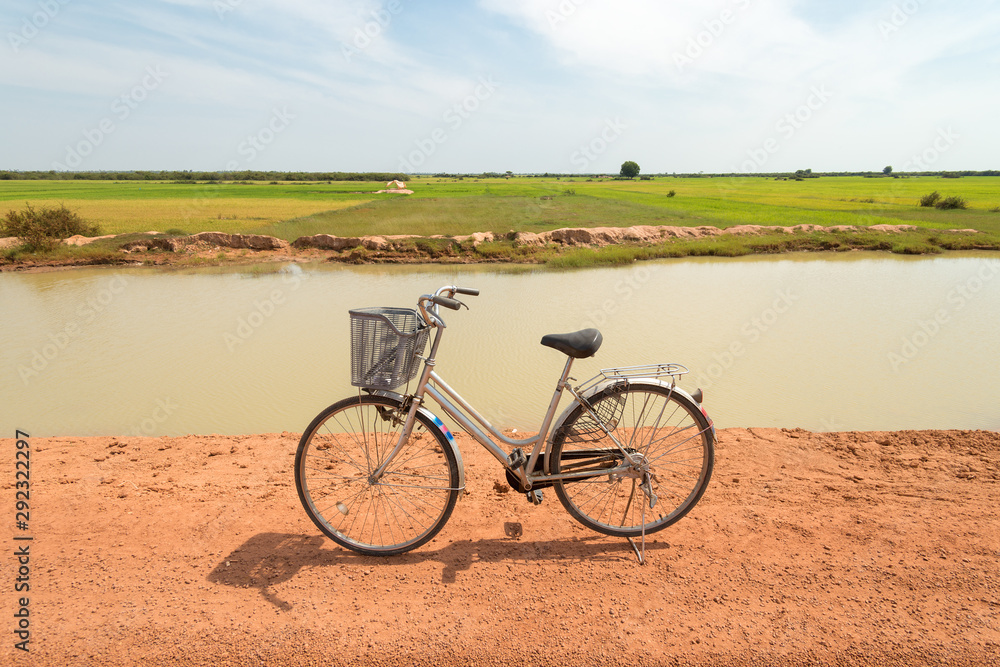 Retro vintage bicycle near the river. Relaxing summer day in the countryside