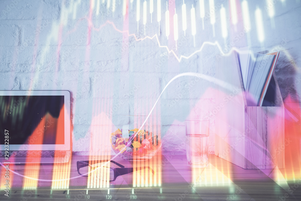 Forex market chart hologram and personal computer background. Multi exposure. Concept of investment. Forex market chart hologram and personal computer background. Multi exposure. Concept of investment.