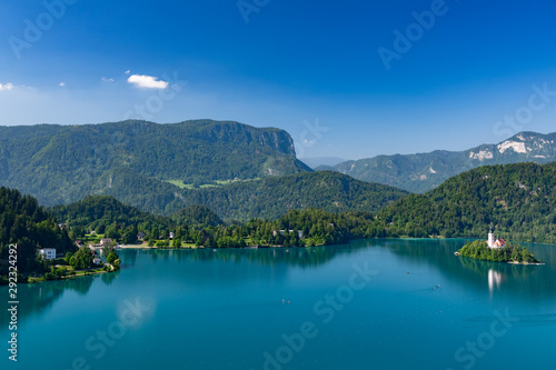 Beautiful landscape of Lake Bled with Pilgrimage Church of the Assumption of Maria with tourist kayaking in the lake.