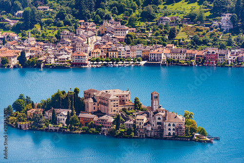 Isola San Giulio (St. Julius Island) in front of the town of Orta on the Orta Lake in the Italian Alps photo