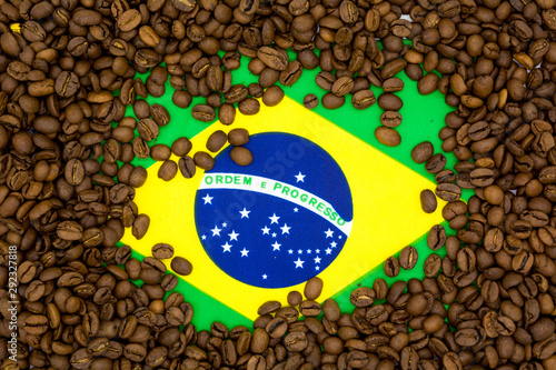 Brazil flag placed under roasted coffee beans
