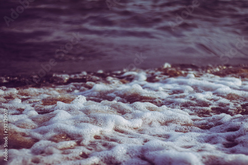 Morning waves on the beach in Kallithea, Greece