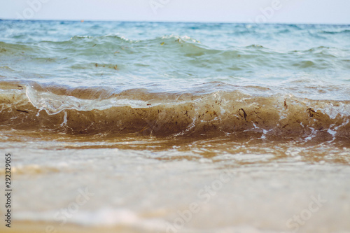 Morning waves on the beach in Kallithea, Greece