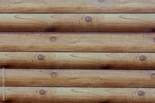Wood texture of horizontally arranged logs. Natural background for the project and design.