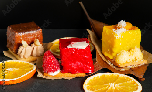 stylish fashionable assortment of lemon raspberry and chocolate cake