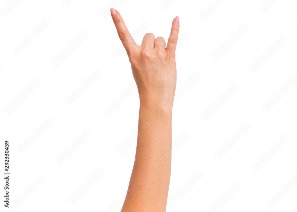 Female hand showing heavy metal Rock gesture, isolated on white background. Beautiful hand of woman with copy space. Hand pointing two fingers. Female hand showing heavy metal Rock gesture, isolated on white background. Beautiful hand of woman with copy space. Hand pointing two fingers.