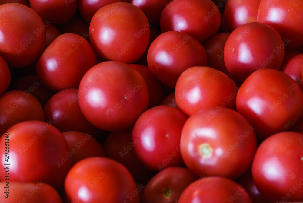 A full box of ripe, red tomatoes, ready for sale. A full box of ripe, red tomatoes, ready for sale.