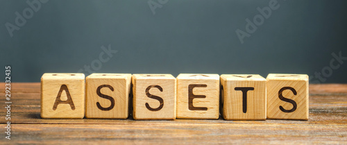 Wooden blocks with the word Assets. Resource owned by the business. Financial accounting. Money and finance. Cash equivalents, certificates of deposit photo