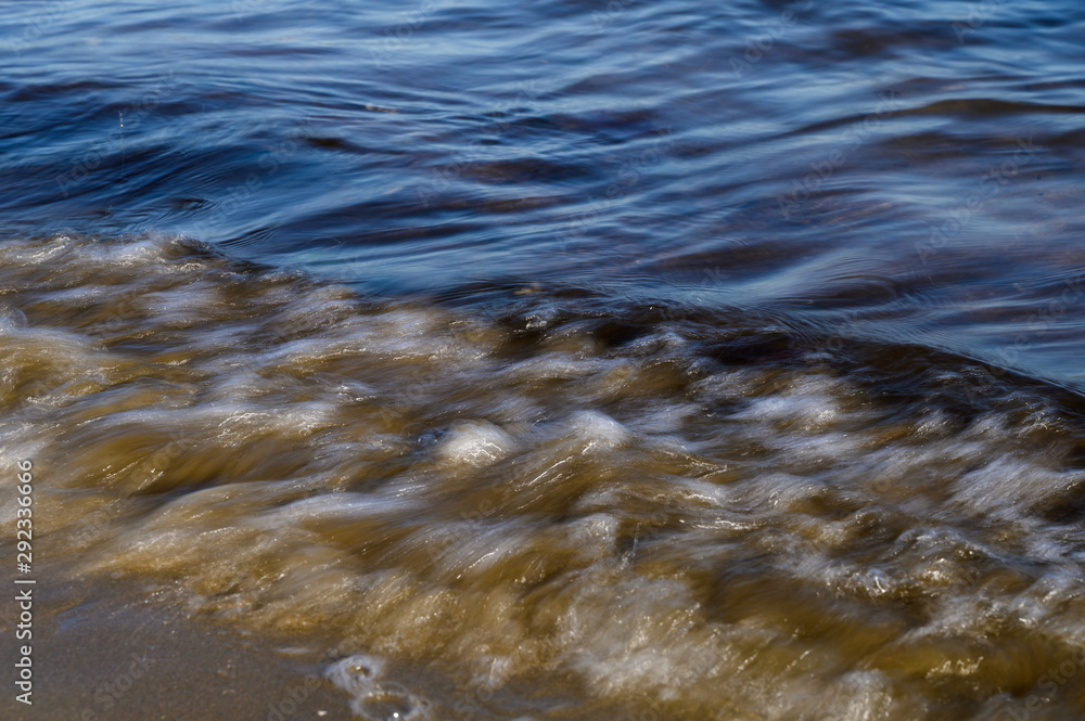 Waves on the seashore captured with a slow shutter speed. Natural abstract motion background. Waves on the seashore captured with a slow shutter speed. Natural abstract motion background.