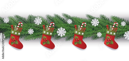 Christmas tree branch border with red gift stockings filled with candy