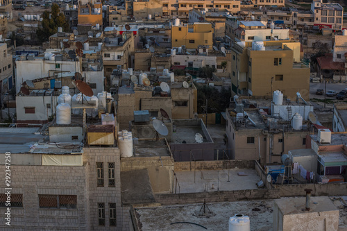 Middle East Arabian ghetto city back streets of houses roofs in Syria after war 