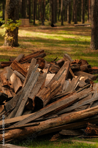 A pile of old wood from house building. Wood recycling. Eco environment concept.