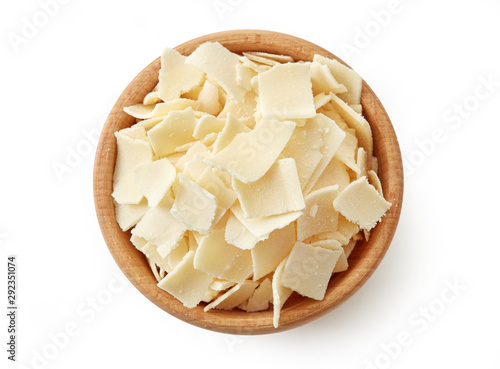 Wooden bowl of parmesan cheese flakes photo