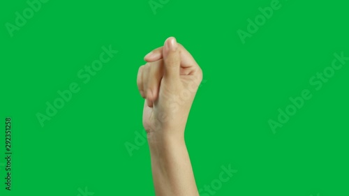 4K. close-up woman hand snap finger or clicks hand isolated on chroma key green screen photo