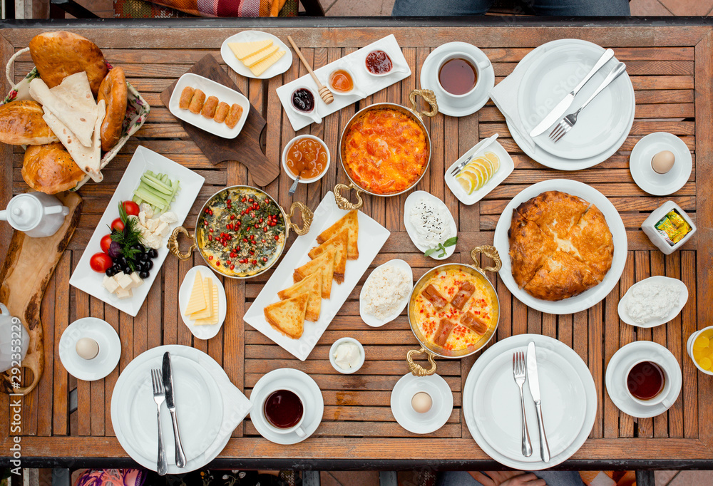 Top view of traditional azerbaijani breakfast with egg dishes, fresh vegetables, honey Top view of traditional azerbaijani breakfast with egg dishes, fresh vegetables, honey